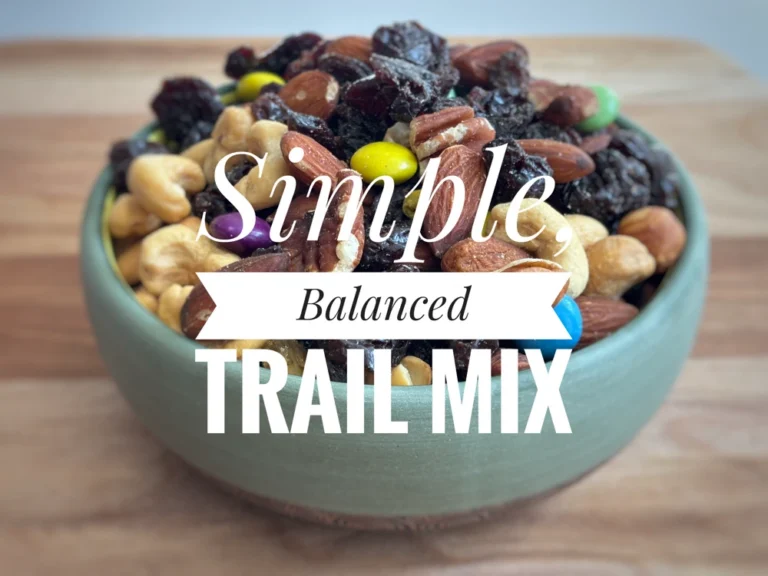 A bowl of trail mix with the text "Simple, balanced trail mix"
