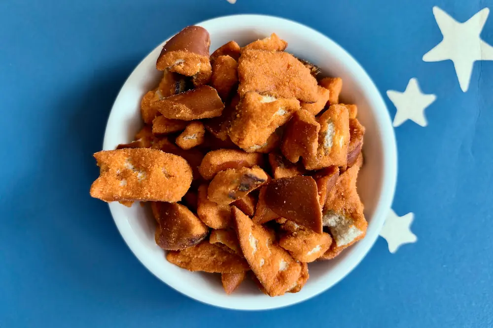 A bowl of Snyder's of Hanover Hot Buffalo Wing Pretzel Pieces seen from above