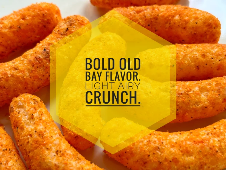 Close up view of Herr's Old Bay Cheese Curls with the text "Bold Old Bay Flavor. Light Airy Crunch."