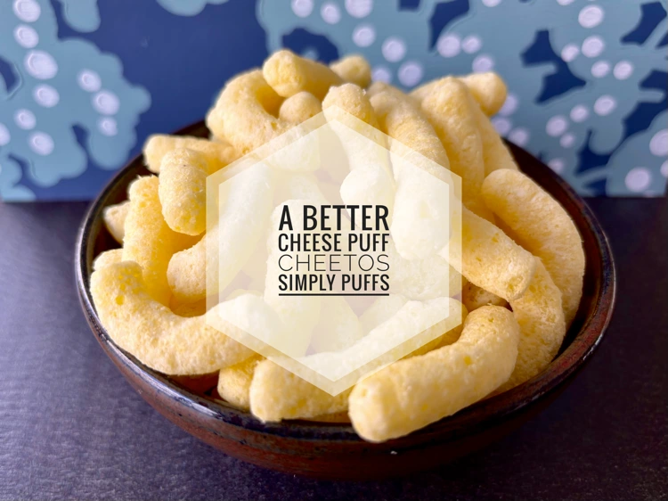 Cheetos Simply Cheese puffs with the text "A Better Cheese Puff, Cheetos Simply Puffs"